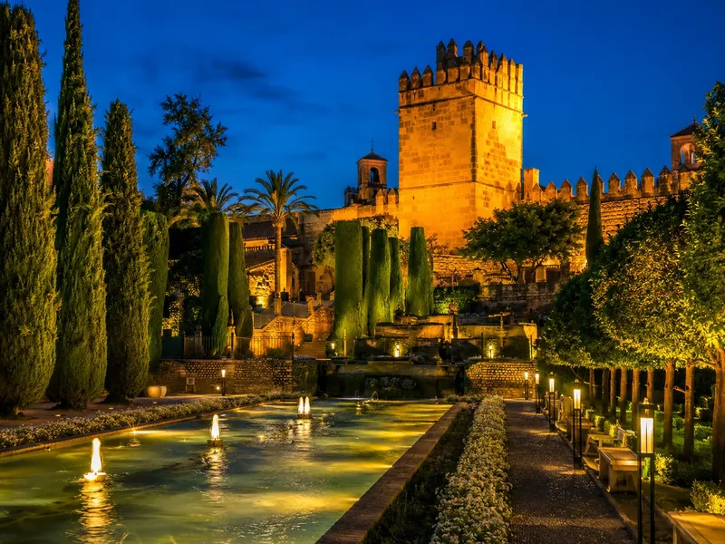 The gardens and fountains lit at night on the €28 evening visit